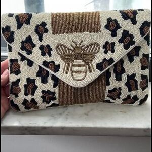 Cute bee design clutch bag.Always got compliments when I went out with this one.